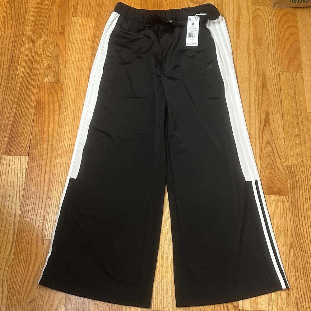 adidas women’s Black Joggers with White Side Stripes size M